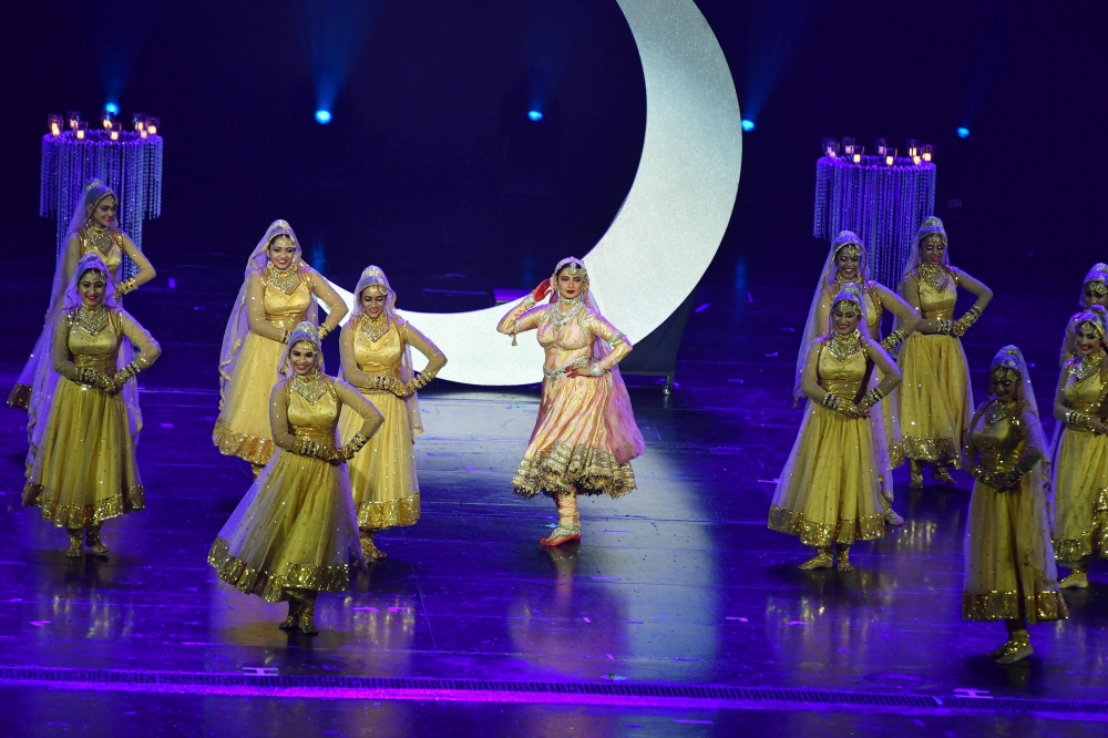 Bollywood actress Rekha, center, performs during the IIFA Awards of the 19th International Indian Film Academy (IIFA) festival at the Siam Niramit Theatre in Bangkok, Thailand on Monday. - AFP