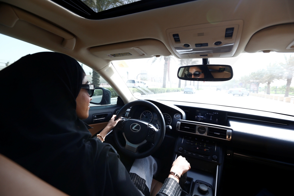 Majdooleen, who is among the first Saudi women allowed to drive in Saudi Arabia, drives her mother to work in Riyadh, on Sunday. — Reuters