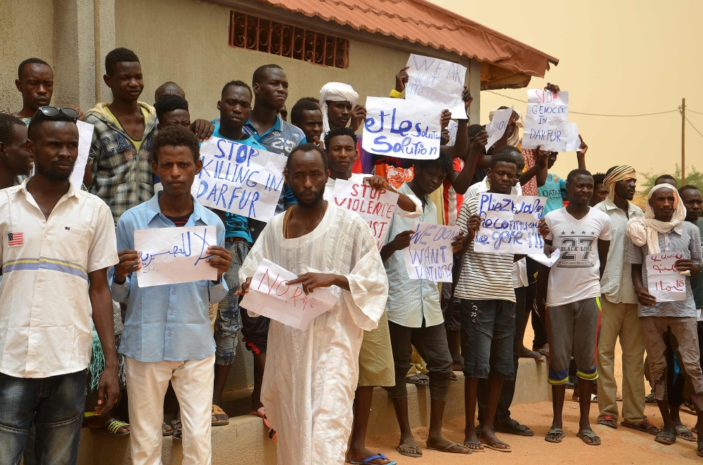 United Nations High Commissioner for Refugees Filippo Grandi poses with a group of refugee children in Agadez. Grandi urged European countries to speed up the procedures for leaving transit countries refugees who have decided to host on their soil. — AFP photos