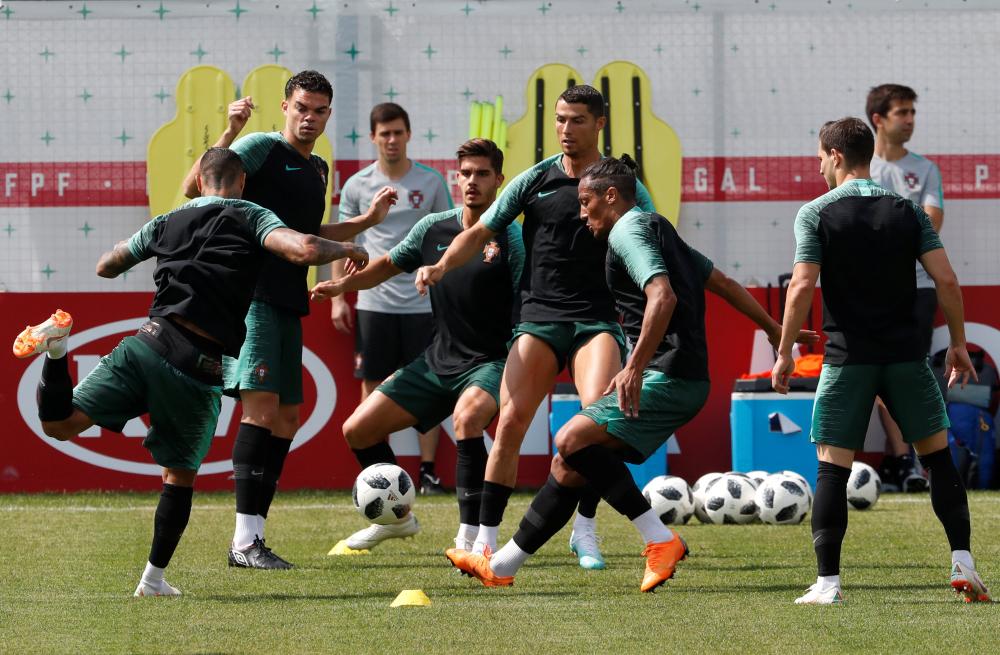 Portugal’s Pepe, Cristiano Ronaldo and Bruno Alves take part in a training session in Kratovo, Moscow Region, Thursday. — Reuters