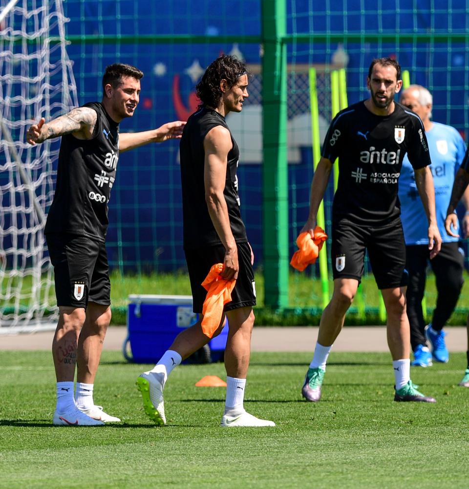 Portugal’s Pepe, Cristiano Ronaldo and Bruno Alves take part in a training session in Kratovo, Moscow Region, Thursday. — Reuters