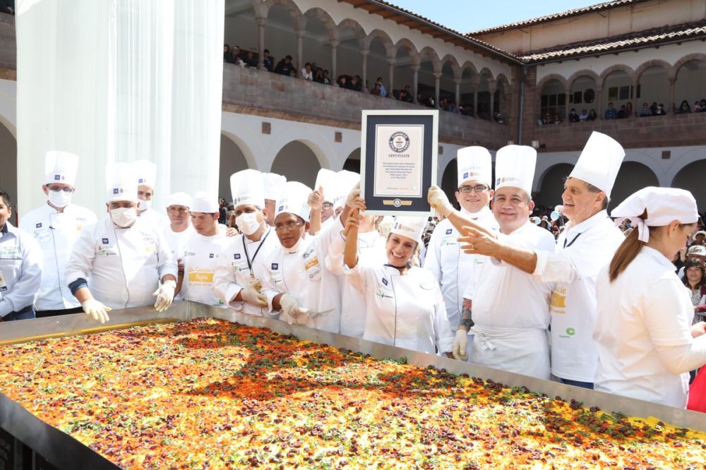 Participants pose with a Guinness World Record certificate for the largest causa in Lima, Peru on Sunday.