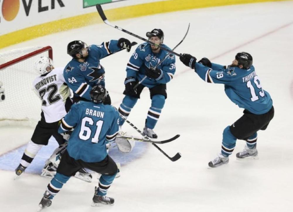 Pittsburgh Penguins right wing Patric Hornqvist (72) watches as San Jose Sharks players Marc-Edouard Vlasic (44) , Logan Couture (39) , Joe Thornton (19) and Justin Braun (61) try to bat the puck out of the air in the third period of game six of the 2016 Stanley Cup Final at SAP Center at San Jose. — Reuters