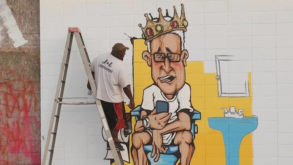 A mural depicting North Providence Mayor Charles Lombardi is seen on the side of a building in North Providence, Rhode Island on Wednesday. - AP