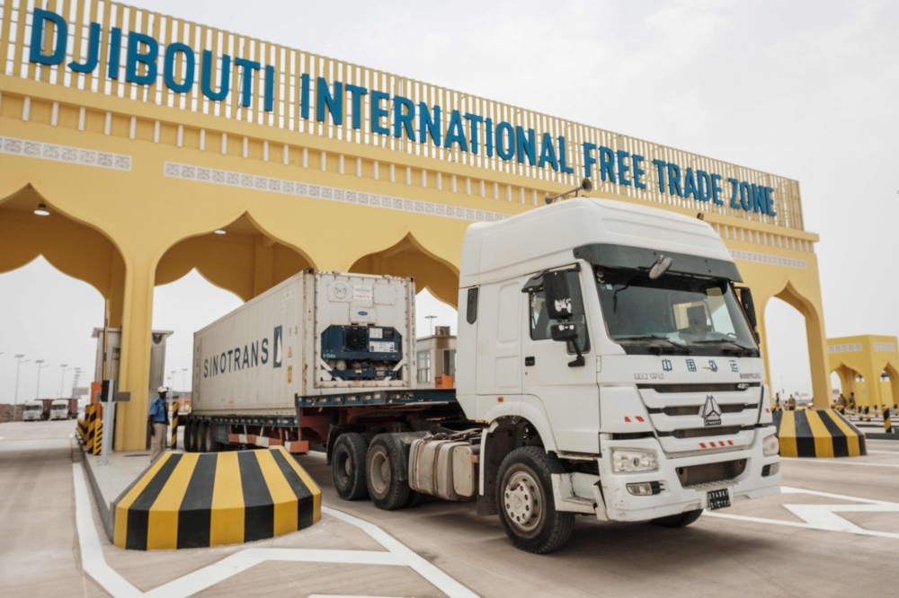 A container truck passes through the main gate of Djibouti International Free Trade Zone (DIFTZ) after the inauguration ceremony in Djibouti on Thursday. — AFP