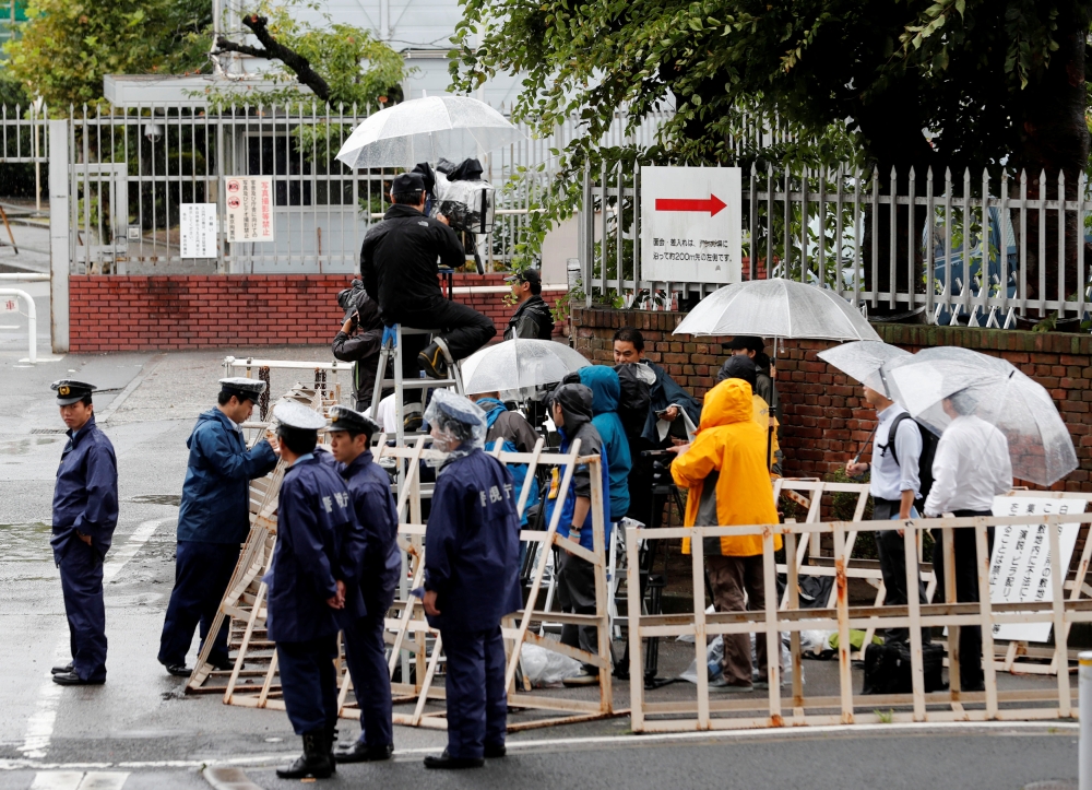 Journalists and policemen stand in front of Tokyo Detention Center where former leader of Aum, the Japanese doomsday cult, Chizuo Matsumoto, who went by the name Shoko Asahara, was executed, in Tokyo, Japan, on Friday. — Reuters