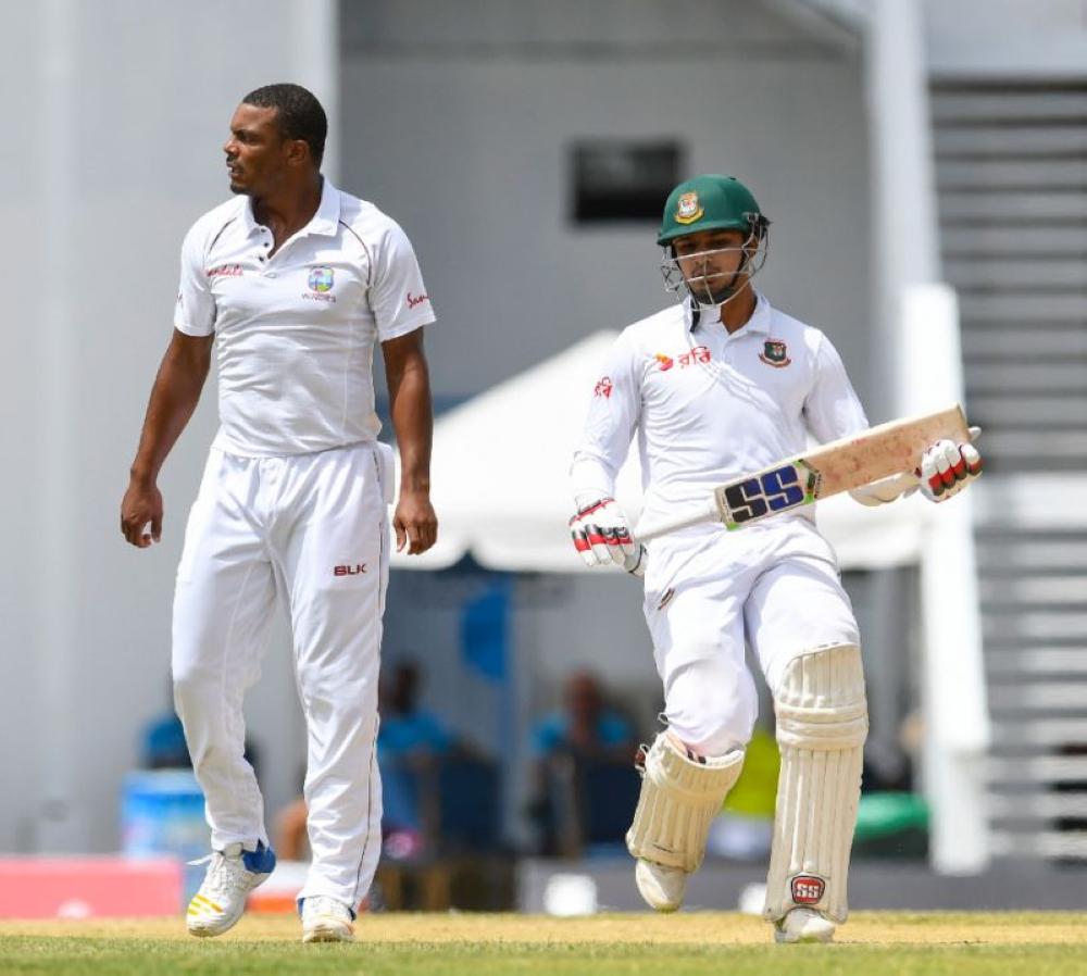 Shannon Gabriel (left) completed his third five-wicket haul but Nurul Hasan (right) took the last morning's honors. — AFP