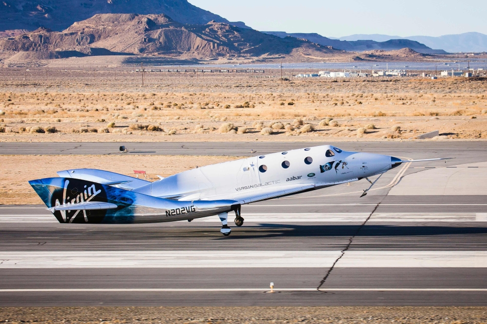 This handout photograph obtained courtesy of Blue Origin in an undisclosed date and place shows the New Shepard booster. The two companies leading the pack in the pursuit of space tourism say they are just months away from their first out-of-this-world passenger flights -- though neither has set a firm date. Virgin Galactic, founded by British billionaire Richard Branson, and Blue Origin, by Amazon creator Jeff Bezos, are racing to be the first to finish their tests -- with both companies using radically different technology. — AFP