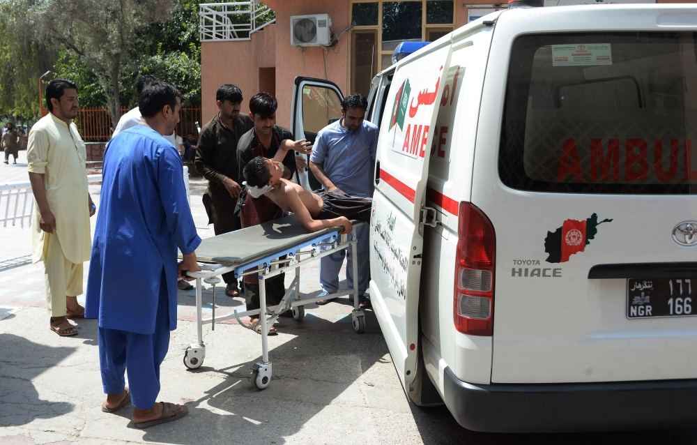 Afghan volunteers carry an injured youth on a stretcher to a hospital following an attack that targeted an education department compound in Jalalabad, Afghanistan, in this July 11, 2018 file photo.  — AFP