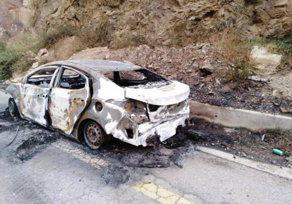 The burned-out car from which the family from Dhamad was rescued.