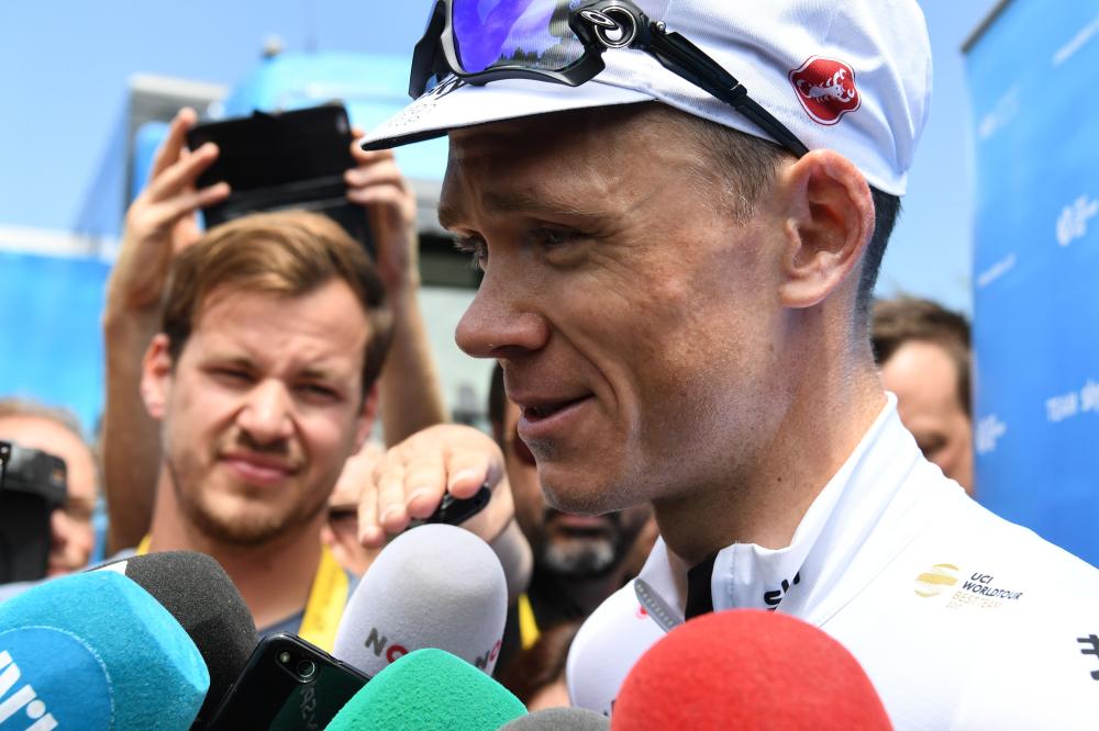 Great Britain's Christopher Froome addresses the media outside his team's hotel in Chambery, following a training session with his Great Britain's Team Sky cycling team teammates on the first rest day of the 105th edition of the Tour de France cycling race Monday. — AFP 
