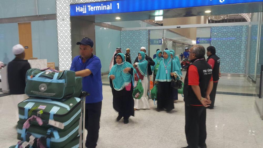 Deputy Interior Minister, Mr. Sutee Makboon (fifth from left), and Shiekhul Islam of Thailand, Mr. Aziz Phitakkumpon (on wheelchair) attended the Blessing Ceremony and seeing off the Thai hajj pilgrims at Hat Yai International airport in Thailand. — Courtesy photos