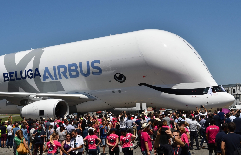 An Airbus 'BelugaXL' aircraft taxis in front of Airbus employees at Toulouse-Blagnac on Thursday, after its maiden test flight of some four hours. The Beluga XL, the new cargo plane of the Airbus family has taken off from Blagnac, in the south of France, for its first test flight. The launch of the aircraft triggered thunderous applause in an audience of more than 10,000 people, mostly employees and subcontractors of the European aircraft manufacturer. — AFP