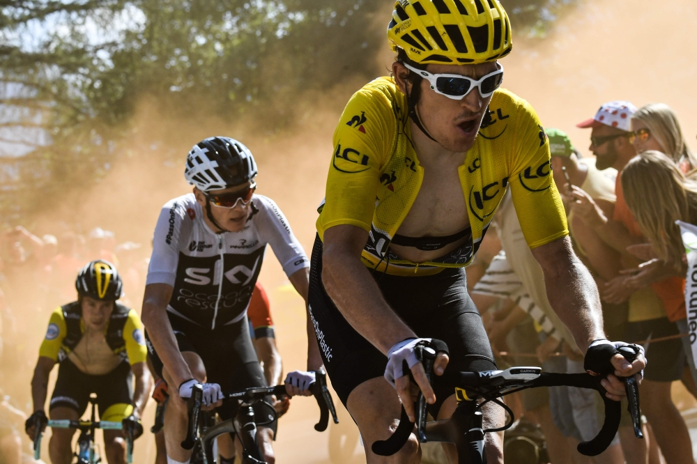 Great Britain's Geraint Thomas, wearing the overall leader's yellow jersey, refreshes himself after winning the twelfth stage of the 105th edition of the Tour de France cycling race, between Bourg-Saint-Maurice - Les Arcs and l'Alpe d'Huez, on Thursday. — AFP