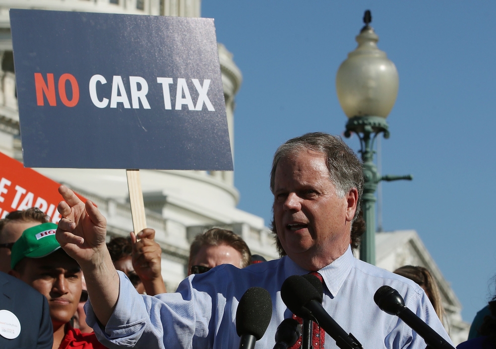 Sen. Doug Jones (D-Al) speaks about US President Donald Trump's proposed tariffs on auto imports and the impact on auto makers and their surrounding communities, during a news conference on Capitol Hill, on Thursday in Washington, DC. — AFP