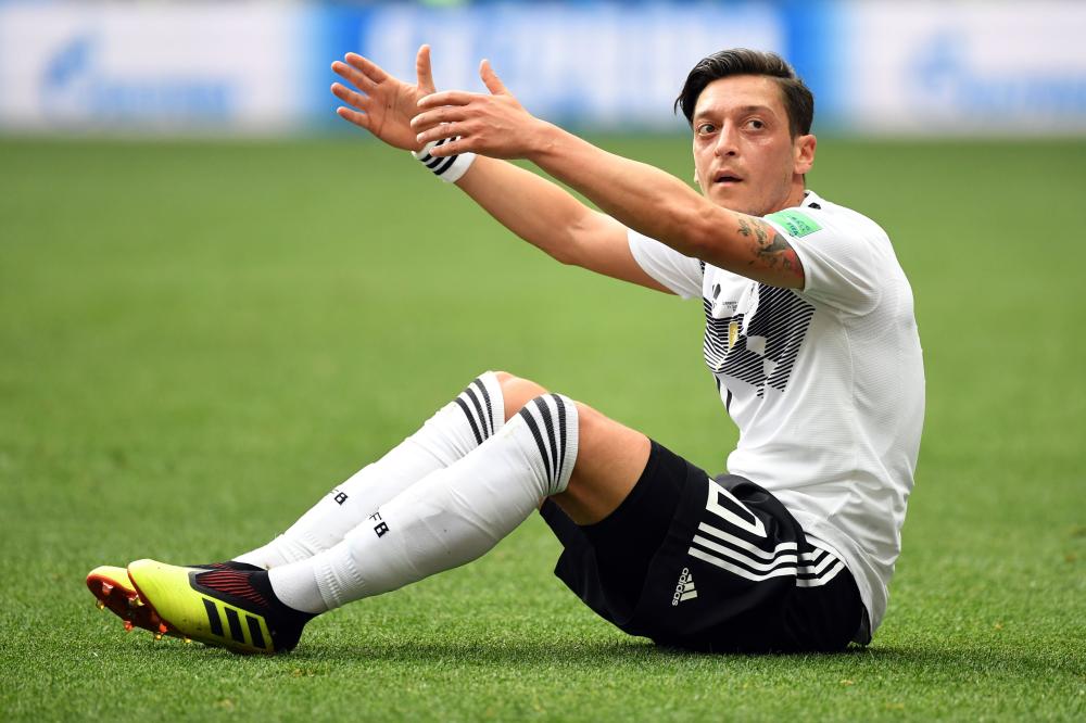 This June 17, 2018 file photo shows Germany’s midfielder Mesut Ozil gesturing as he sits on the field during the Russia 2018 World Cup Group F football match against Mexico at the Luzhniki Stadium in Moscow. — AFP 