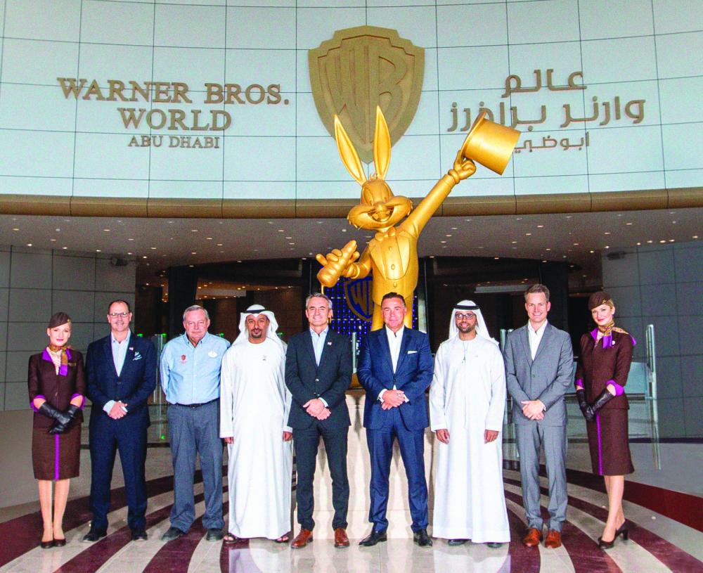 From left: Etihad Airways cabin crew with Liam Findlay, Farah Experiences’ Vice President of Sales & Marketing; Mark Gsellman, Warner Bros. World Abu Dhabi’s General Manager; Alhasan Kaabous Alzaabi, Farah Experiences’ VP Operations; Olivier Garaialde, Farah Experiences’ CEO; Robin Kamark, Etihad Airways’ Chief Commercial Officer; Jamal Al Awadhi, Etihad Airways’ Head of Guest Experience and Patrick Pierce, Etihad Airways’ VP Marketing Partnerships at Warner Bros. Abu Dhabi to mark new partnership

