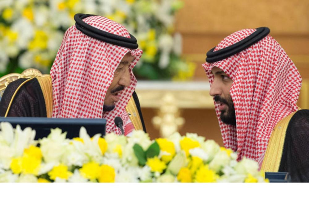 Custodian of the Two Holy Mosques King Salman talks to Crown Prince Muhammad Bin Salman, deputy premier and minister of defense, at the Cabinet session at Al-Salam Palace in Jeddah on Tuesday. — SPA