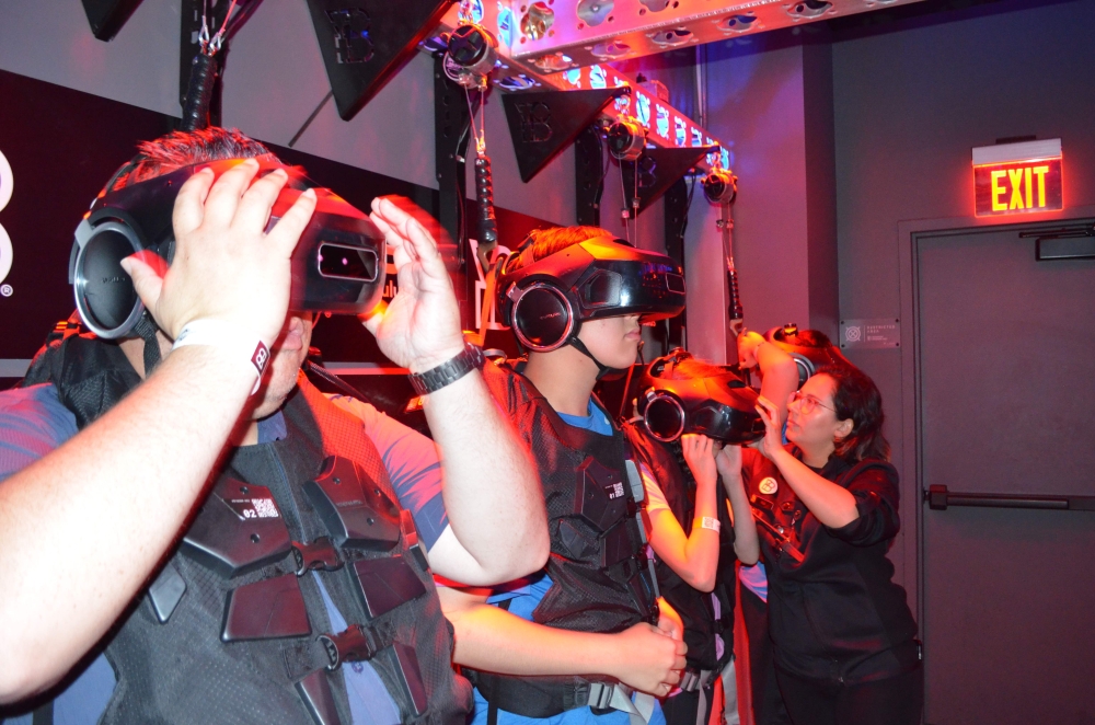 Clients of the VR attraction The Void put on their 3D head sets in Anaheim, California. - AFP