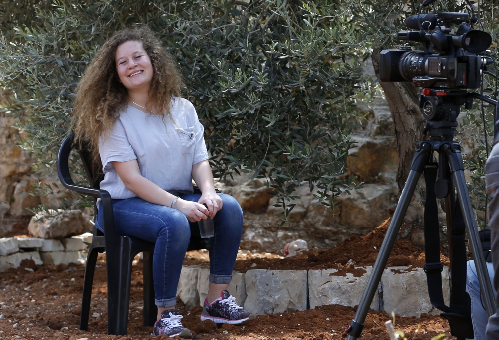 Palestinian activist and campaigner Ahed Tamimi, 17, listens during an interview with Agence France-Presse (AFP) in the West Bank village of Nabi Saleh, Monday. — AFP
