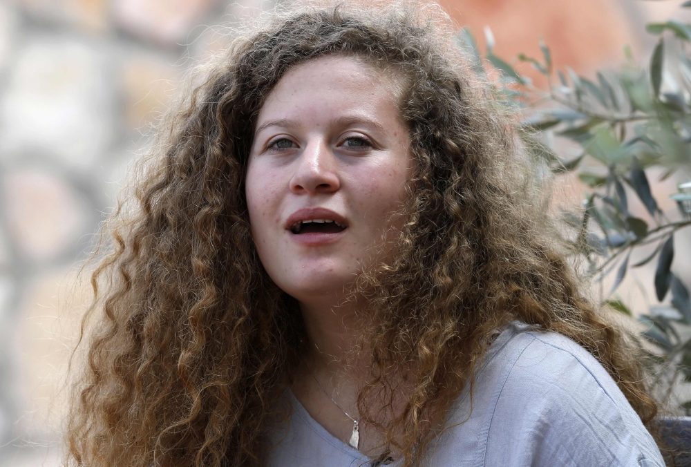 Palestinian activist and campaigner Ahed Tamimi, 17, listens during an interview with Agence France-Presse (AFP) in the West Bank village of Nabi Saleh, Monday. — AFP