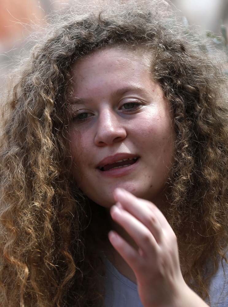 Palestinian activist and campaigner Ahed Tamimi, 17, listens during an interview with Agence France-Presse (AFP) in the West Bank village of Nabi Saleh, Monday. — AFP