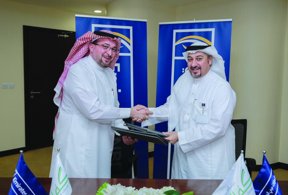 Eng. Loai Hassan Abduljawad, CEO Emirates NBD KSA and Homam Abdulaziz Hashim, Kafalah Director General sign the agreement