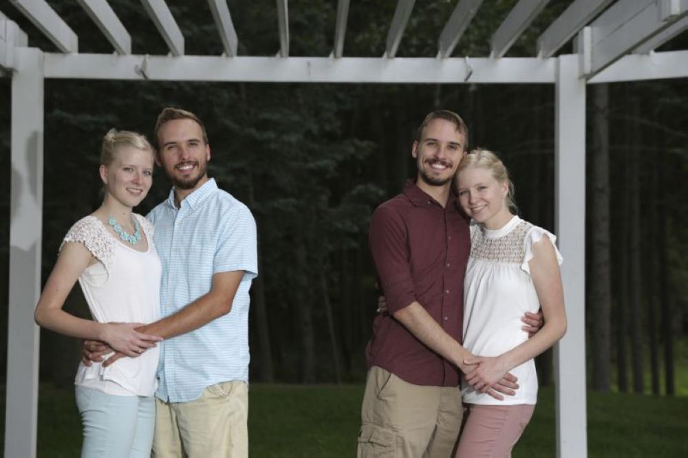 From left, Krissie Bevier with fiance Zack Lewan and Nicholas Lewan with fiance Kassie Bevier, pose for a photo in Grass Lake, Michigan on Wednesday. - AP