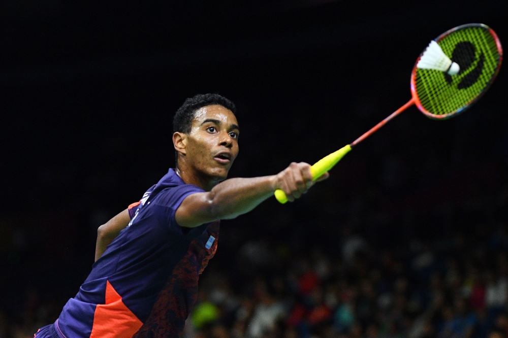 Ygor Coelho of Brazil hits a shot against Chou Tien Chen of Taiwan in their men's singles match during the badminton World Championships in Nanjing, Jiangsu province on Thursday. — AFP