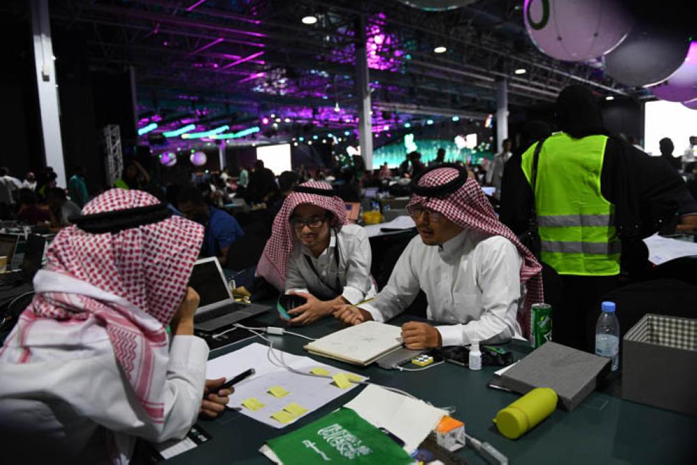 The Japanese team in the traditional Saudi dress during the Hajj Hackathon in Jeddah. — Courtesy photos