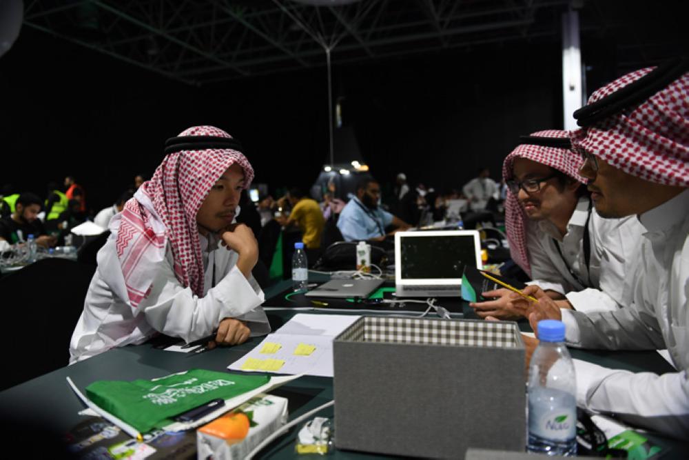The Japanese team in the traditional Saudi dress during the Hajj Hackathon in Jeddah. — Courtesy photos