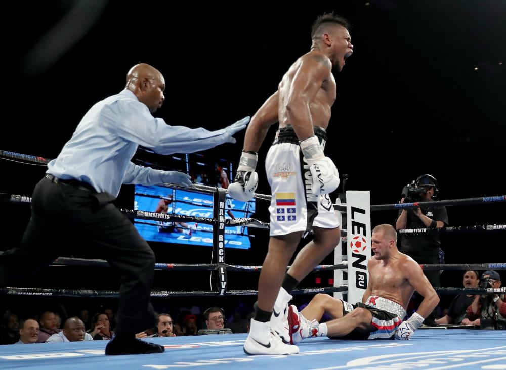 Eleider Alvarez celebrates after knocking down Sergey Kovalev during the WBO/IBA light heavyweight title bout at the Hard Rock Hotel & Casino in Atlantic City, New Jersey, Saturday. — AFP
