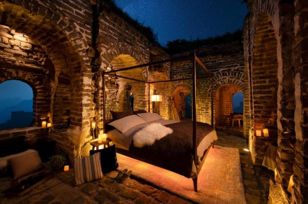 An overview of the bedroom in a custom-designed home situated along the ancient portion of the Great Wall of China.