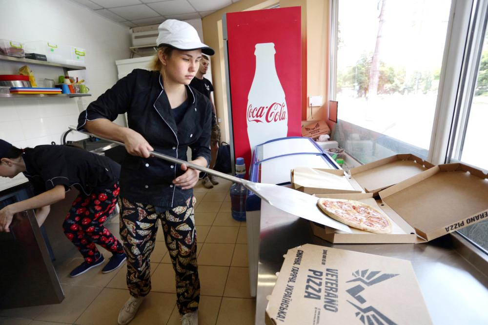 An employee of pizzeria 