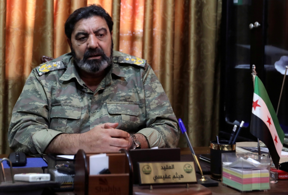 Col. Haitham Afisi talks during an interview with Reuters at his office in the town of Azaz, Syria. — Reuters