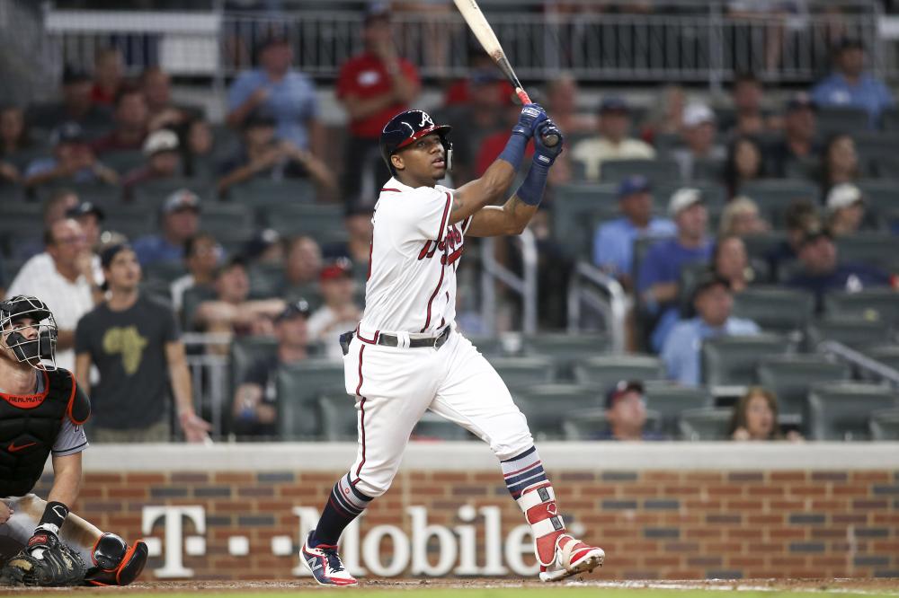 Atlanta Braves’ left fielder Ronald Acuna Jr. hits a three-run home run against the Miami Marlins during their MLB game at SunTrust Park in Atlanta Tuesday. — Reuters