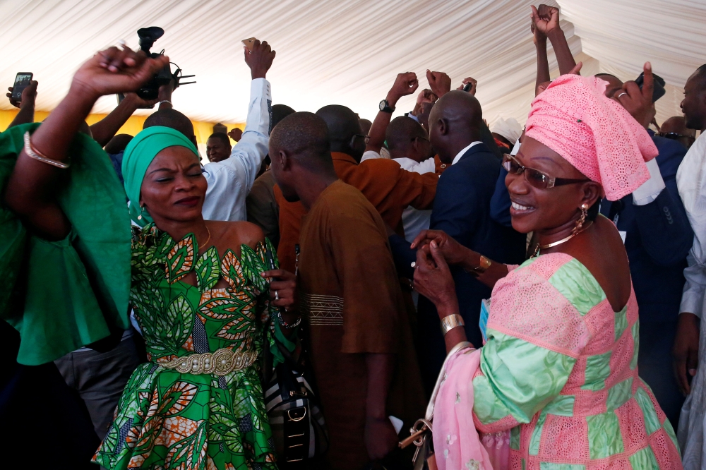 Supporters of Malian President Ibrahim Boubacar Keita celebrate at the Rally for Mali (RPM) party’s headquarters in Bamako on Thursday. — Reuters