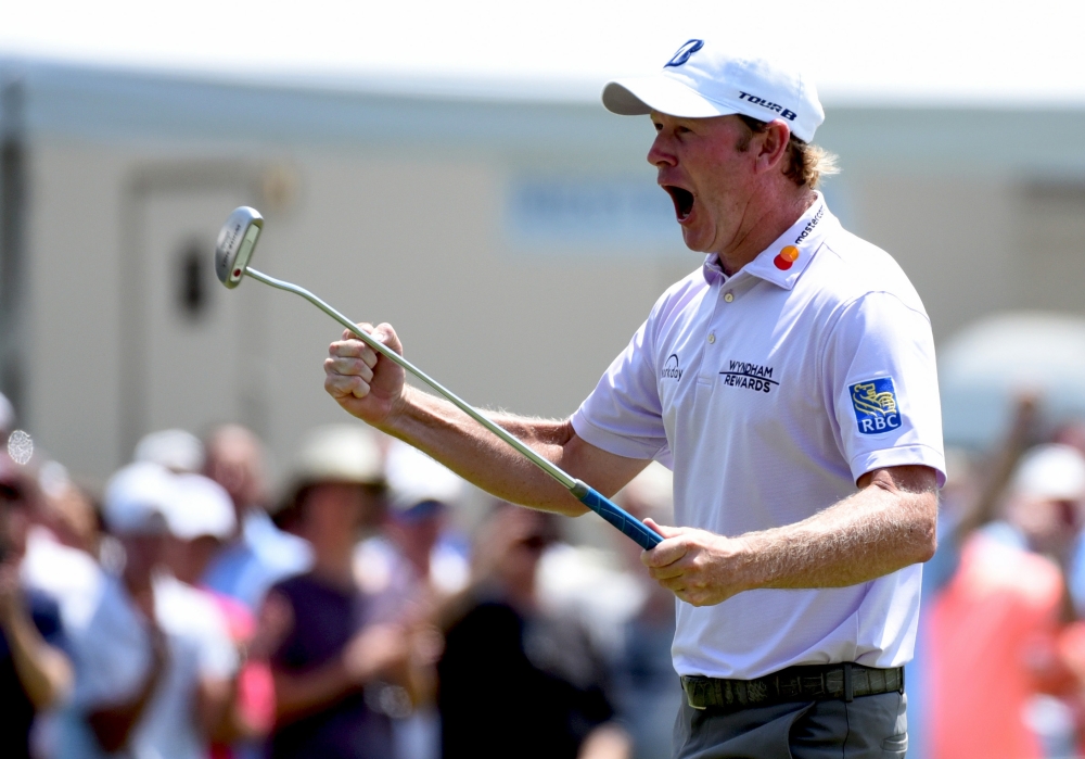 Brandt Snedeker reacts after sinking a birdie putt on the nine hold to shoot a 59 during the first round of the Wyndham Championship golf tournament at Sedgefield Country Club, in Greensboro, NC, on Thursday. — Reuters