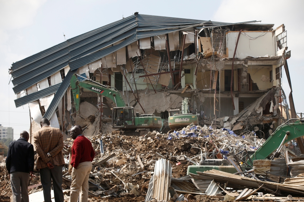 People watch as heavy machinery demolishes the UKAY Mall in Westlands, Nairobi, in this Aug. 14, 2018 file photo. — Reuters