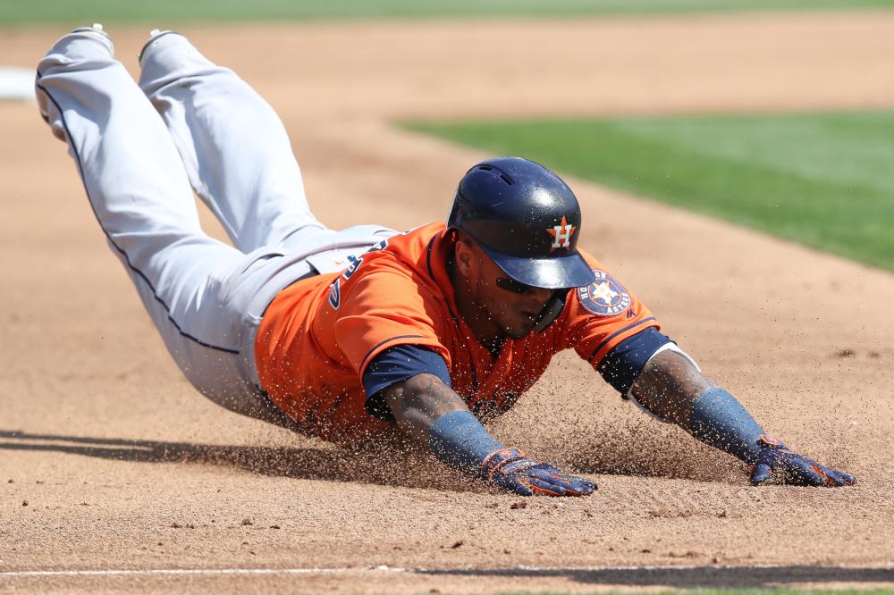 Houston Astros’ catcher Martin Maldonado slides into third base for a triple during their MLB game against the Oakland Athletics at Oakland Coliseum Sunday. — Reuters