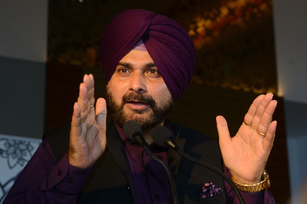 Indian Punjab Cabinet Minister Navjot Singh Sidhu speaks during the launch of new Air Asia services from Kuala Lumpur to Amritsar during a press conference at Taj hotel in Amritsar in this Aug. 17, 2018 file photo. — AFP