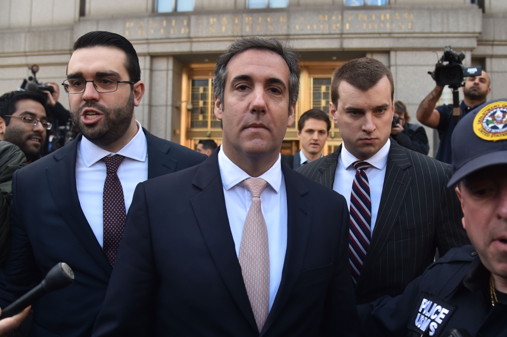 US President Donald Trump’s personal lawyer Michael Cohen, center, leaves the US Courthouse in New York in this April 26, 2018 file photo. — AFP