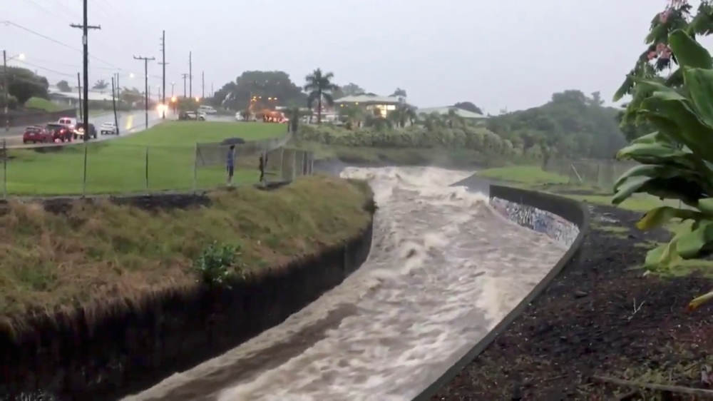 Stormwater flows through a drainage system after Hurricane Lane in Hilo, Hawaii, on Friday in this still image taken from a video obtained from social media on Saturday. — Reuters
