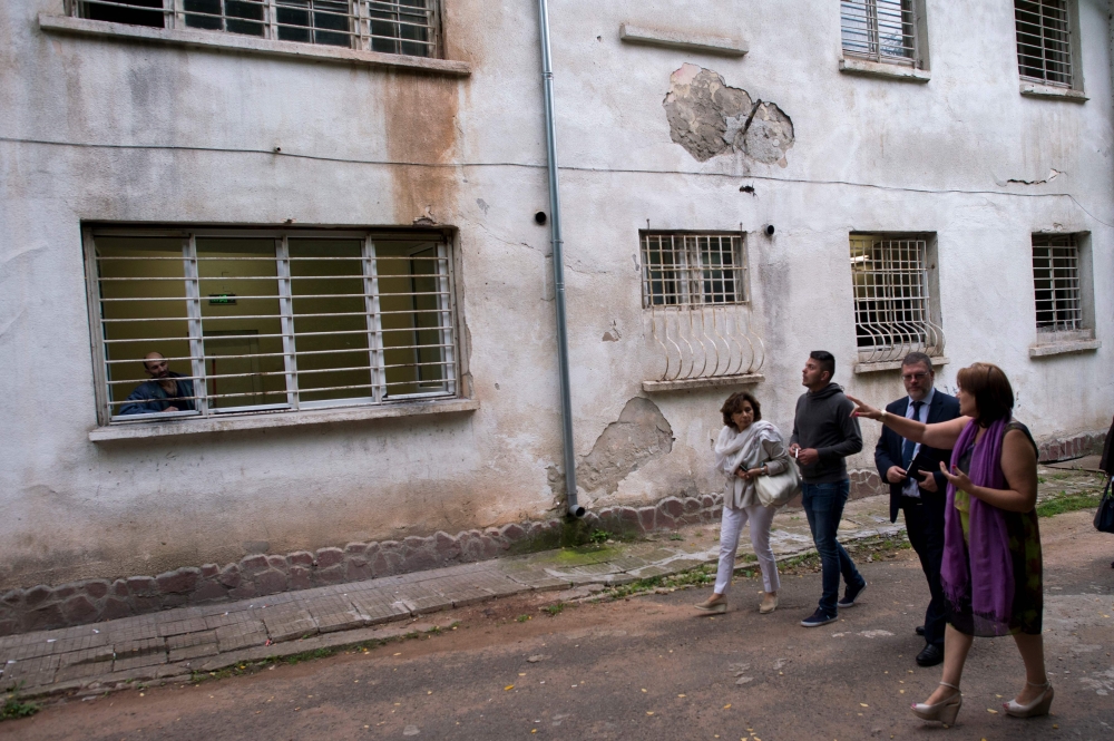 Medical workers look on during an inspection of the European Psychiatric Association (EPA) in the psychiatric hospital in Kurilo, near Sofia. - AFP
