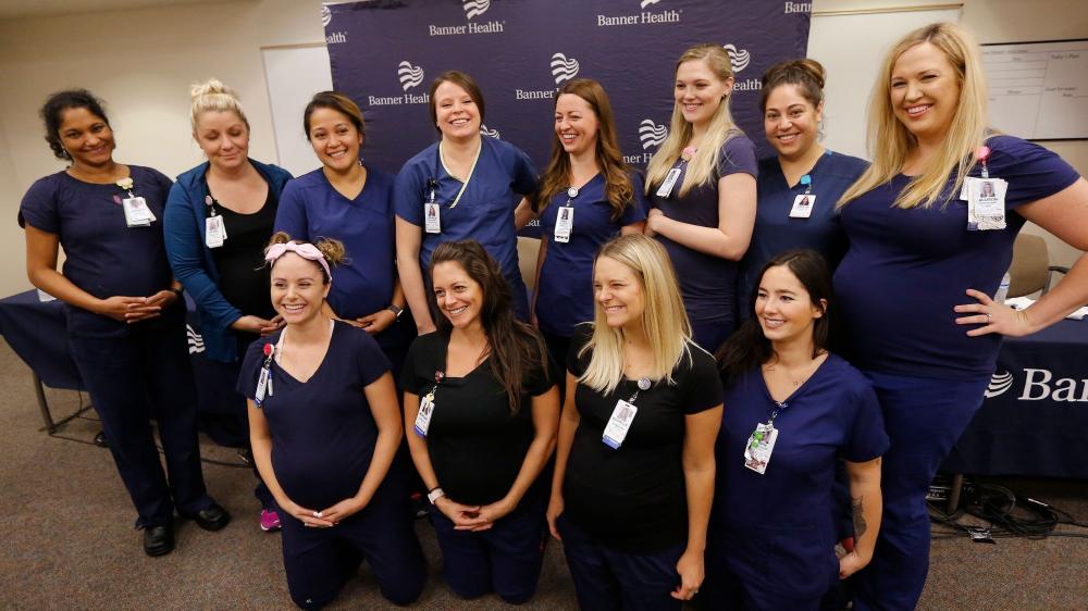 Nurses from Banner Desert Medical Center pose for a group photo during a press event at the hospital in Mesa outside of Phoenix, Arizona. - AP