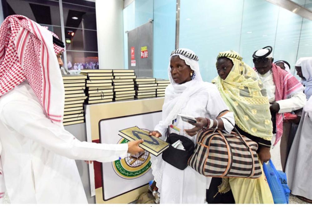 Copies of the Holy Qur'an being presented to departing Haj pilgrims in Madinah. – SPA