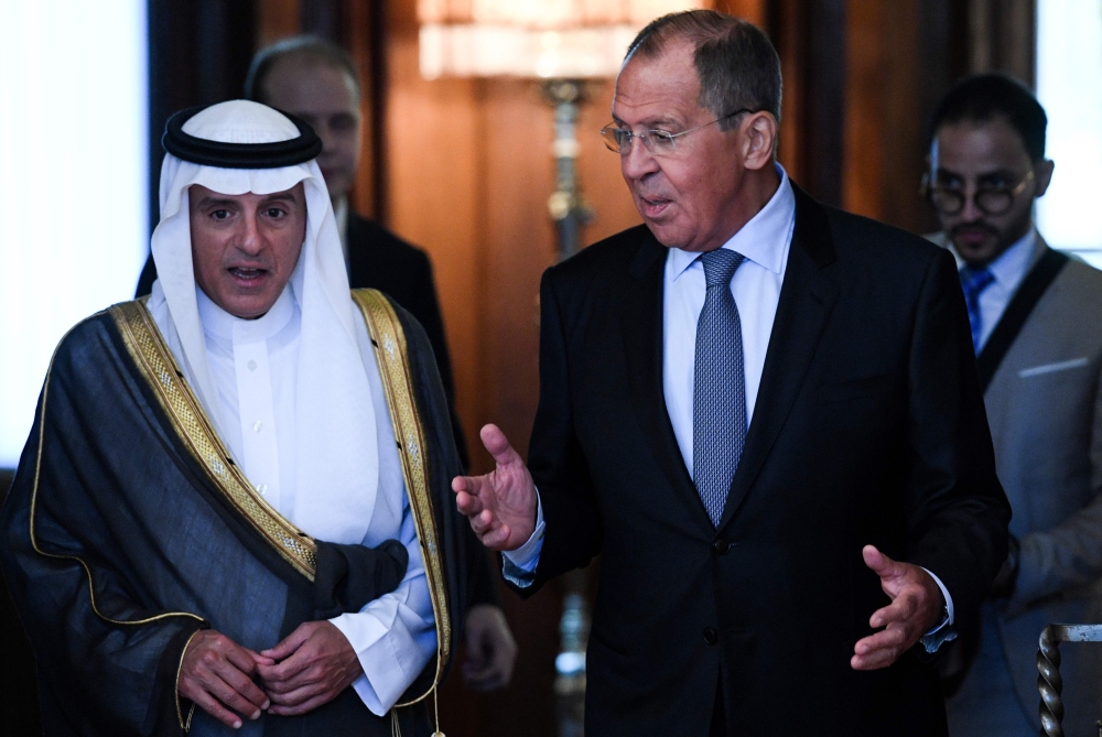 Russian Foreign Minister Sergei Lavrov (R) speaks with Saudi Foreign Minister Adel Al-Jubeir during their meeting in Moscow on Wednesday. — AFP