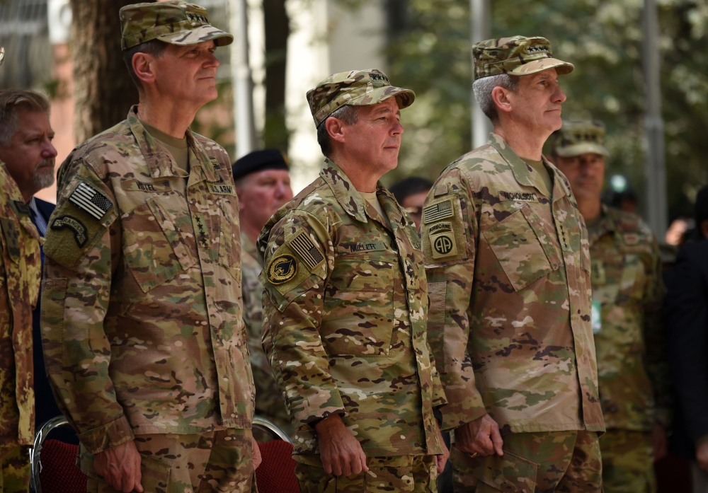 Incoming General Scott Miller (C), command of US and NATO forces in Afghanistan, outgoing US Army Gen. John Nicholson (R) and US army Gen. Votel (L) look on during a change of command ceremony at Resolute Support in Kabul on Sunday. — AFP