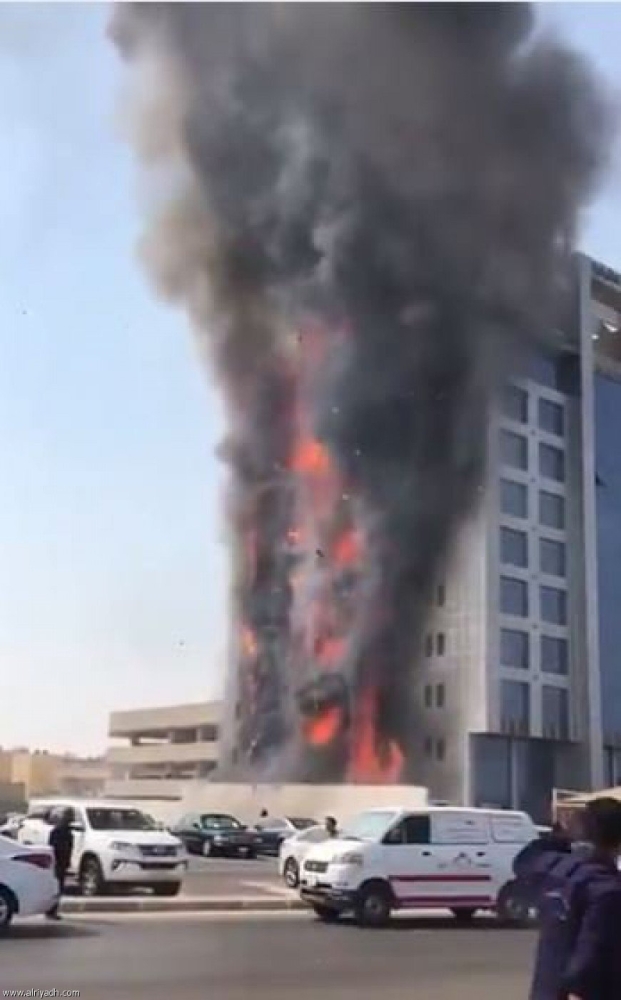 Thick, black plumes of smoke billow into the sky as a huge fire engulfs a section of the Public Prosecution building in Dammam on Sunday.