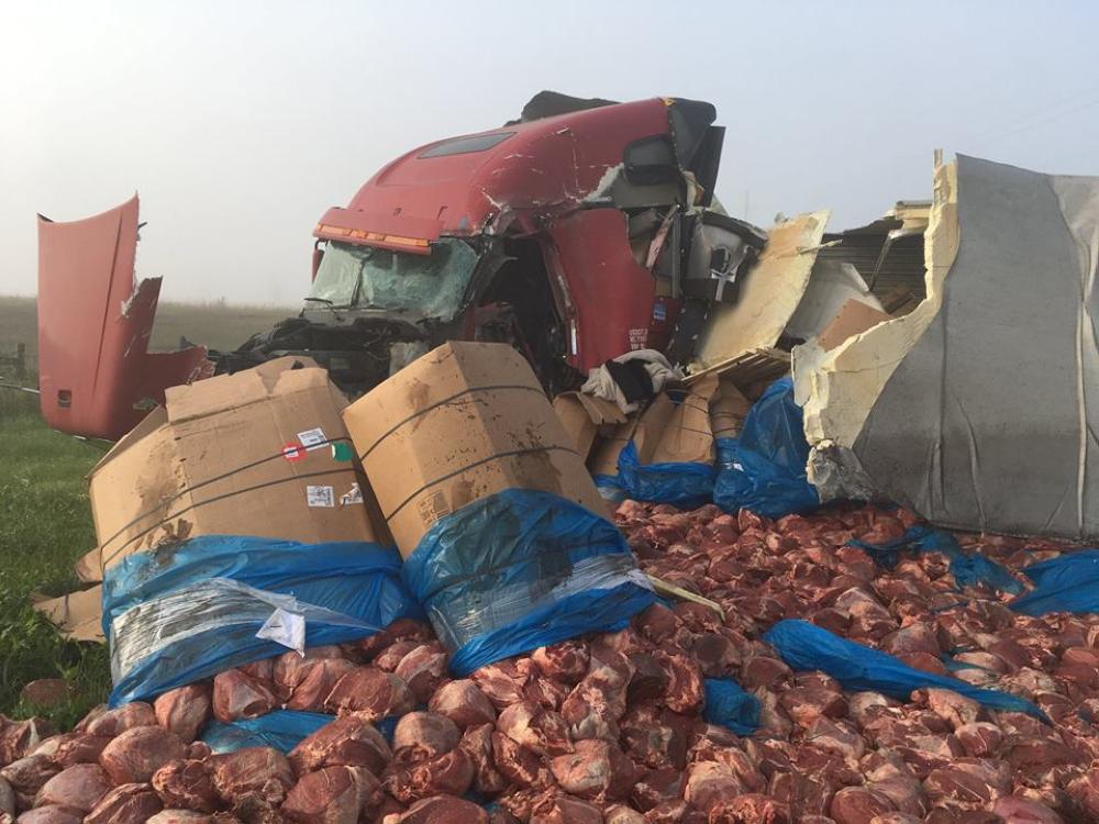 The aftermath of an accident between two semi trucks in which 15 tons of beef roasts spilled out onto Highway 12 close to Summit, South Dakota.
